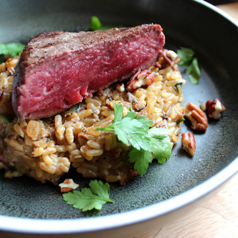 Steak on blue cheese, spinach and pecan risotto