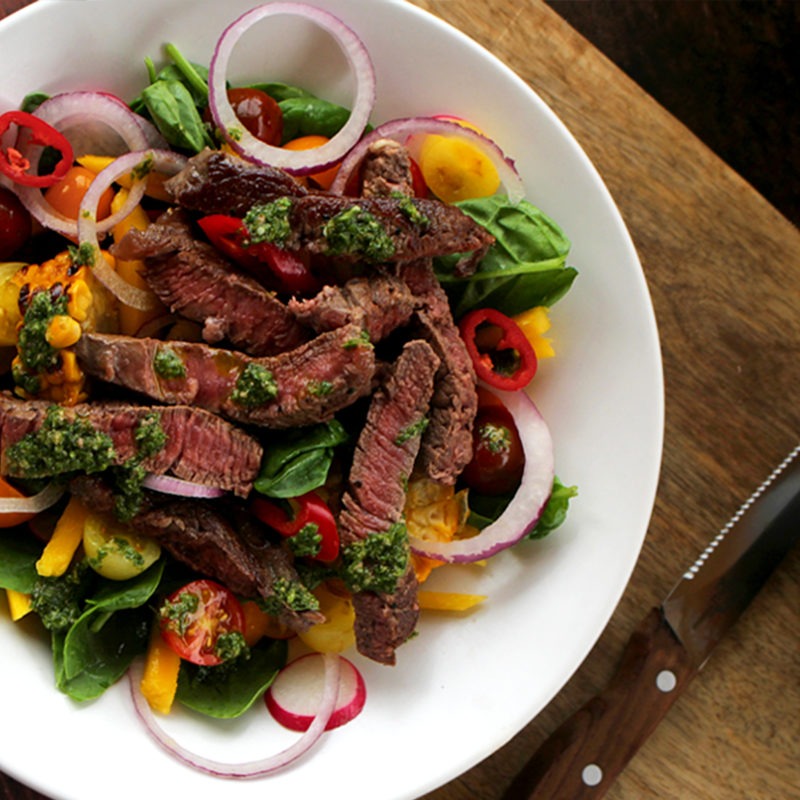 Rib eye and spinach salad with green herb sauce