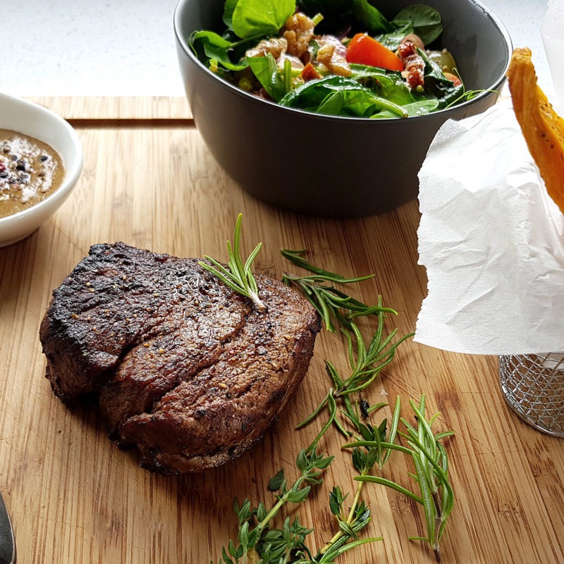 Fillet Steak with peppercorn sauce, spinach salad and sweet potato fries